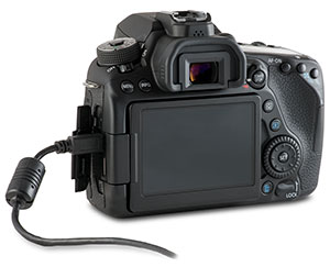 Canon 80D camera with USB cable in side port and open door