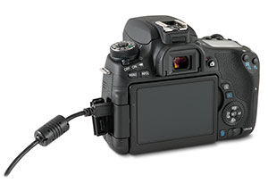 Canon T6s camera with USB cable in side port and open door
