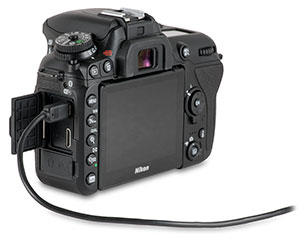 Nikon D7500 with USB cable in USB port for transferring images from camera with door open